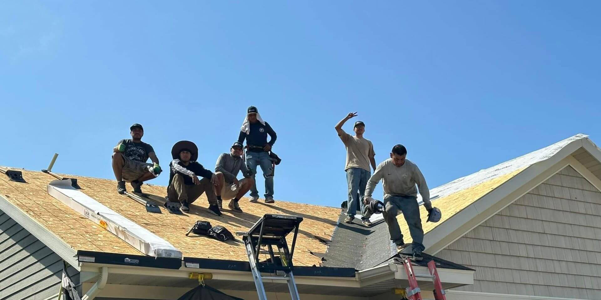 Workers On Roof